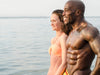 How to get shredded: A muscular man and woman stand beside the ocean