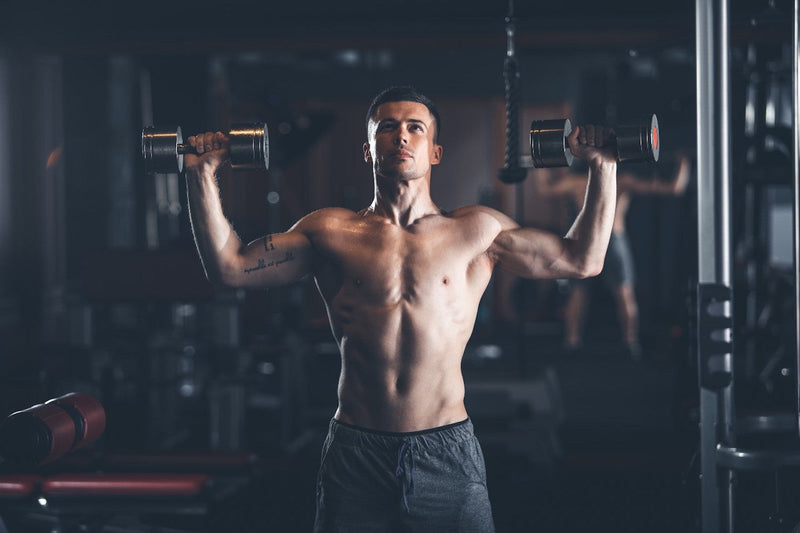 Best shoulder workout: Man lifting dumbbells