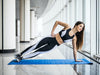 Oblique exercises: Woman in sportswear doing side plank