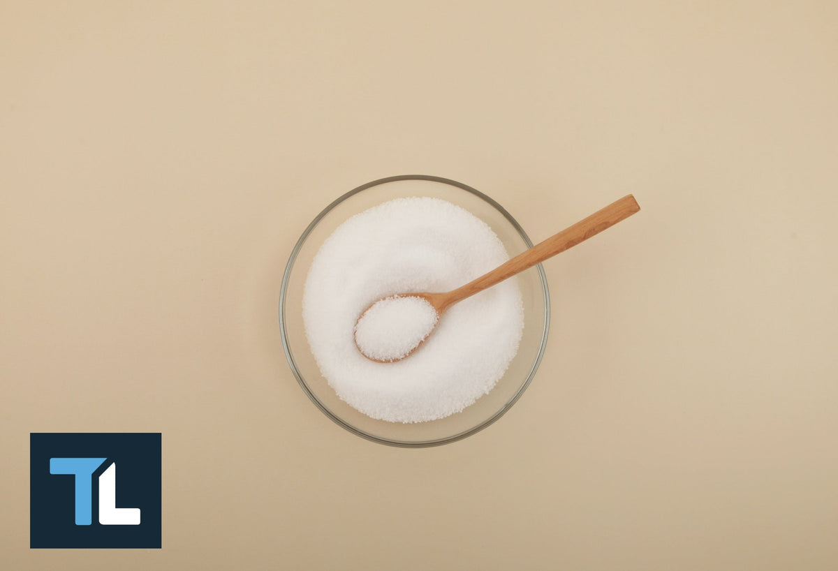 Is Splenda bad for you: Sugar in a metal spoon on a wooden table