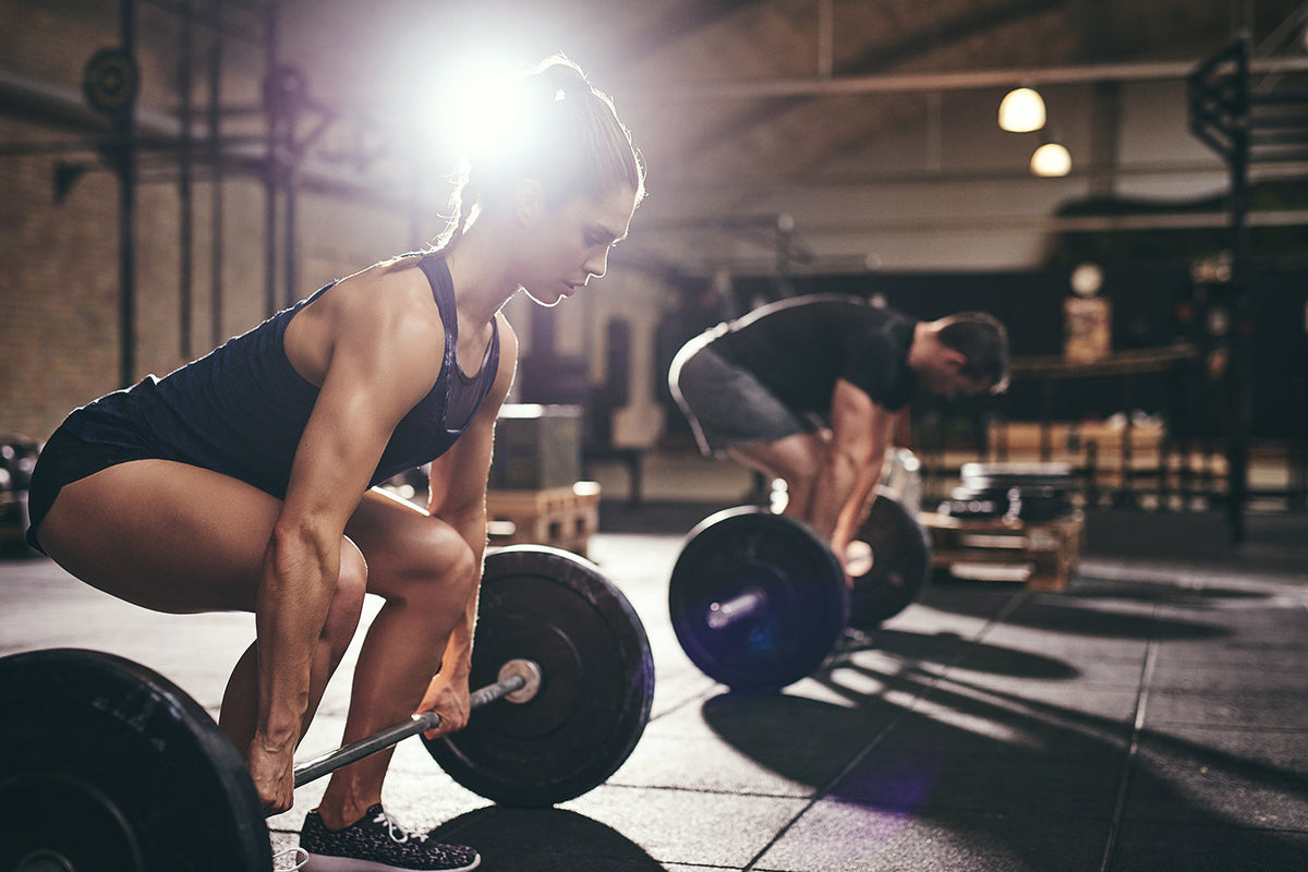 free weight exercises: Woman lifting at the gym