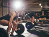 free weight exercises: Woman lifting at the gym