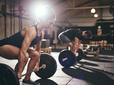 free weight exercises: Woman lifting at the gym