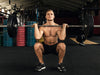 Man doing quad exercises in a gym
